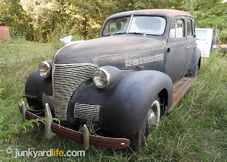 Classic 1939 Chevy behind barn in Tennessee, original with 590 miles on odometer.