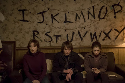 Winona Ryder, Millie Bobby Brown and Charlie Heaton in Stranger Things