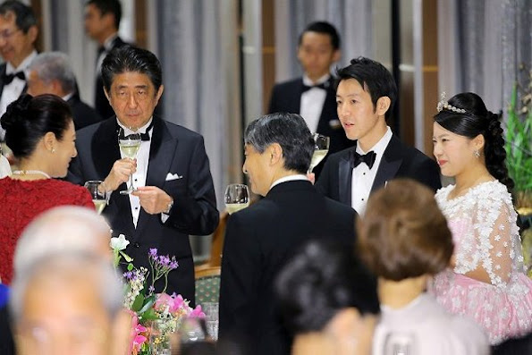 Crown Prince Naruhito and Crown Princess Masako at weeding banquet. Princess Ayako wore a pink silk dress designed by designer Norio Suzuki