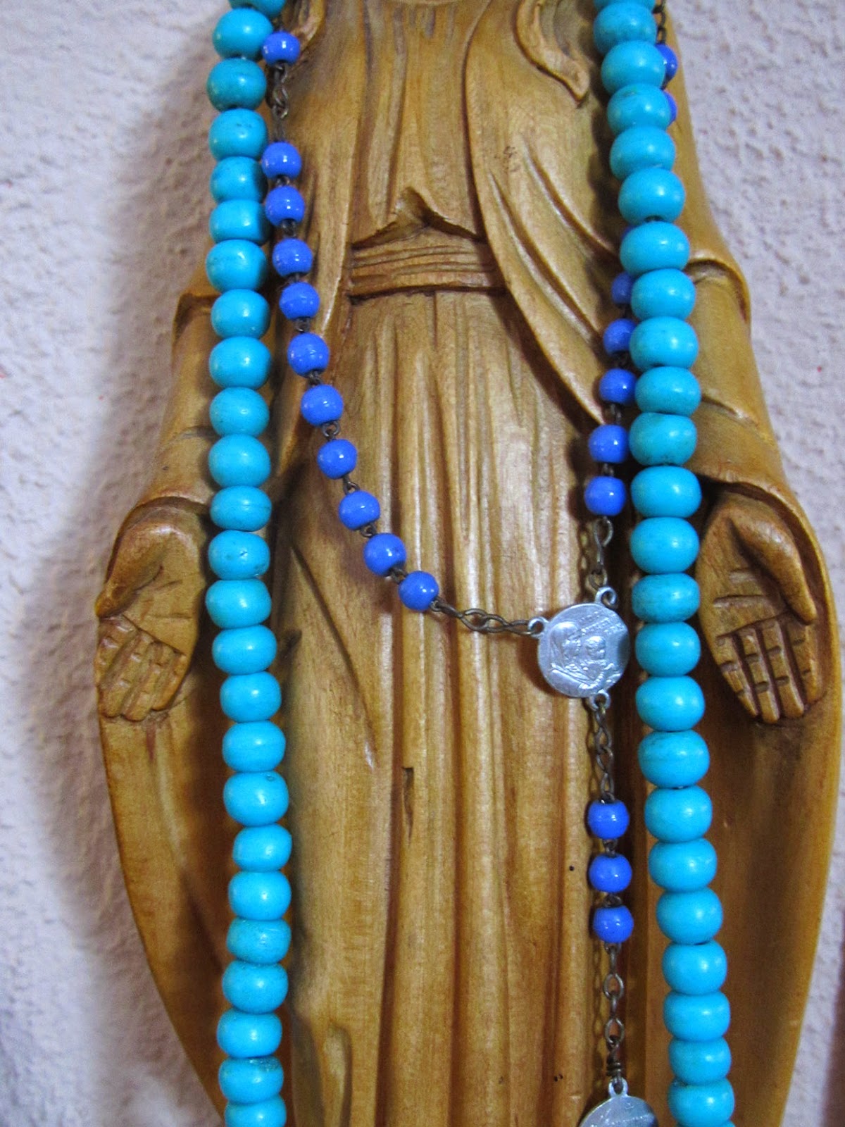virgin Mary with rosary and mala