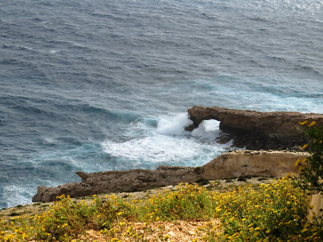 Things to do in Malta: Watch the waves crash through the arch at Ħaġar Qim