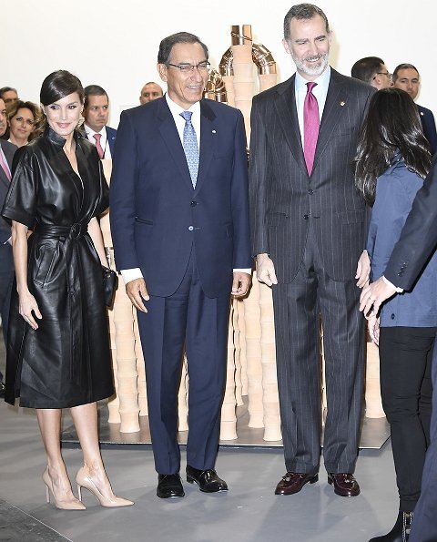 Queen Letizia wore &Other Stories Belted Leather Midi Dress, Prada nude pumps and carried Uterque clutch bag