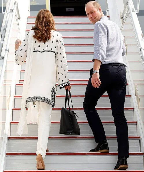 Kate Middleton wore a Kurta by Elan, one of Pakistan's leading design houses. Kate wore a crossover flat shoes by Russell and Bromley