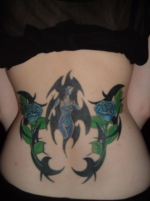 tattoo on lower back for girls. tattoos for girls.
