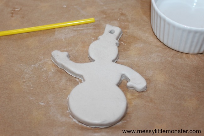 Fingerprint Snowman Christmas Ornament.  An easy kids craft and keepsake using salt dough or air dry clay. Perfect for a toddler or preschoolers Winter or Christmas project.