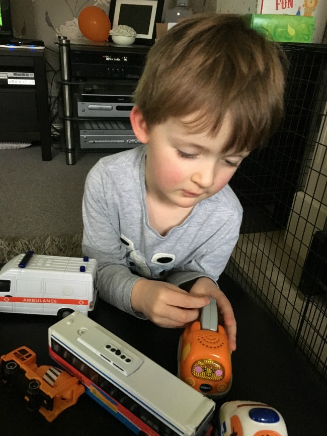 boy-playing-with-toy-vehicles