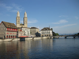Wasserkirche and the towers of Grossmünster along the Limmat, Zürich, Switzerland.