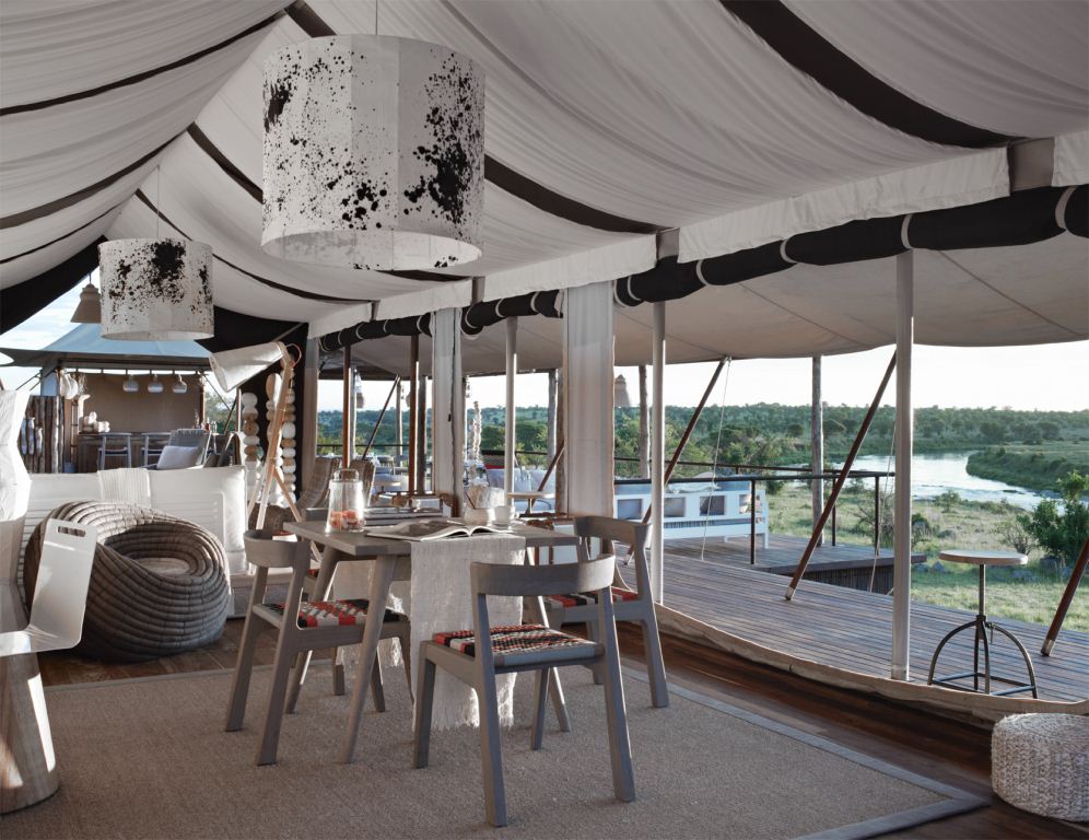 African Safari Lounge with Velted Traibal Chair at Tent at Singita Lodge, Mara River, Tanzania African safari decor ideas