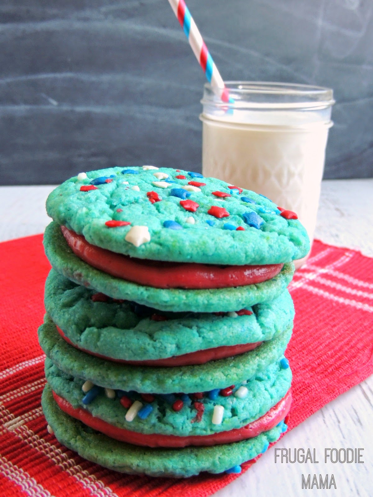 A fresh raspberry buttercream is sandwiched between two soft & chewy blue velvet cake mix cookies in these perfectly patriotic Blue Velvet & Raspberry Buttercream Cookiewiches.