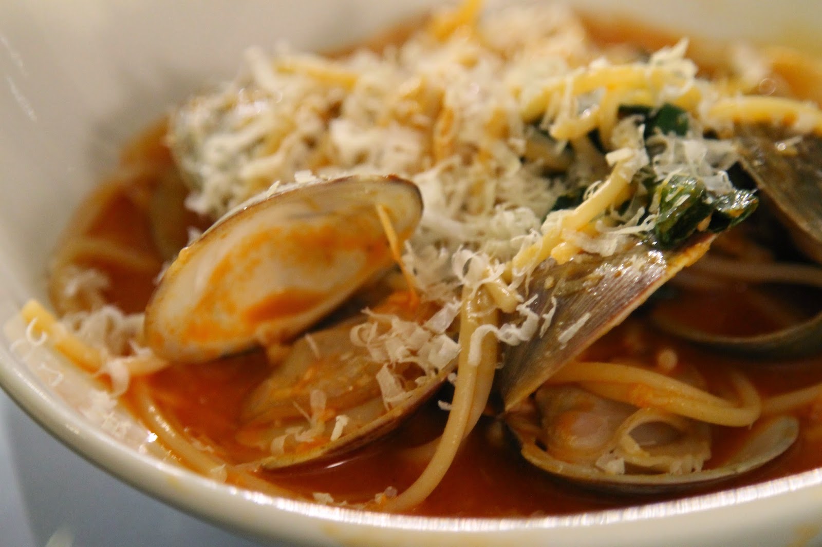 epicurean evolution Spaghetti with Clams, Squid and Braised Greens