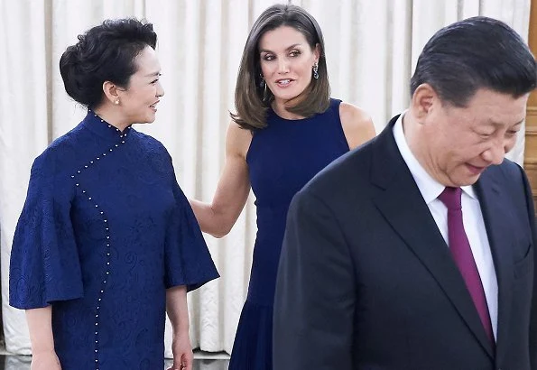 Queen Letizia wore Felipe Varela skirt and top and Nina Ricci pumps. Peng Liyuan. Queen Victoria Eugenia's Cartier diamond earrings