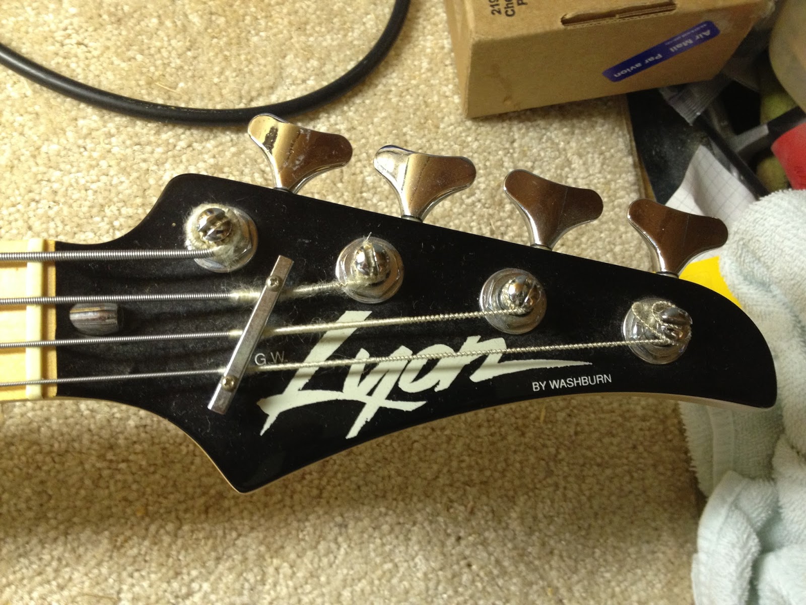 The nut was in good condition. It turned smoothly, and was just barely engaging the neck in tension. After a few partial turns with an Allen wrench on the ...