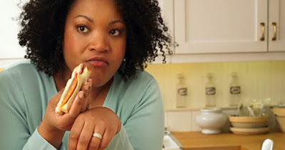 Woman eating processed food and bread