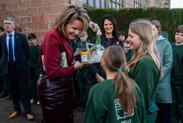 Queen Mathilde of Belgium visited a Horticultural School (Tuinbouwschool) in Melle. brown leather skirt silk blouse