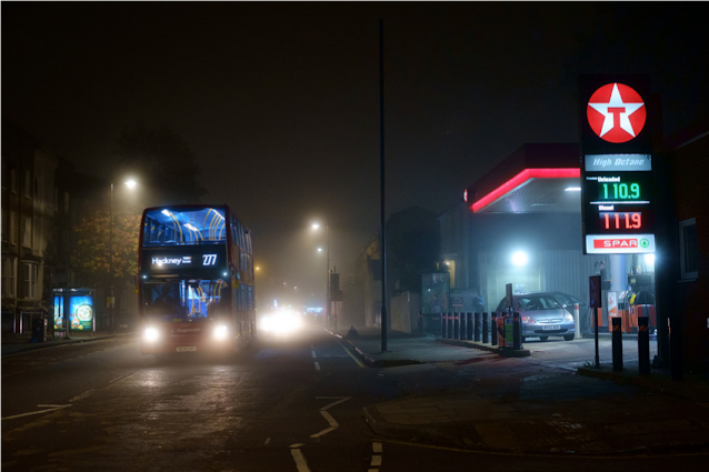 The Texaco Garage emerging from the fog as a 277 bus passes by.