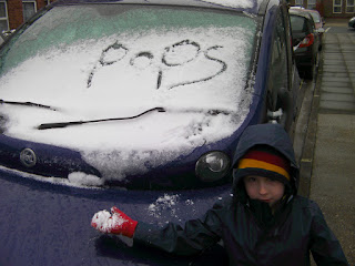 graffiti in snow on vehicle