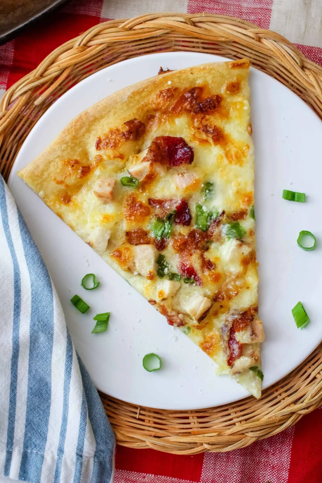 Chicken Alfredo Pizza will rock your pizza night! Topped with cubed chicken, bacon, and cheesy alfredo sauce, this is a pizza you will want to make again and again!  #pizza #chicken #alfredosauce