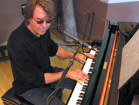 John McAndrew playing piano