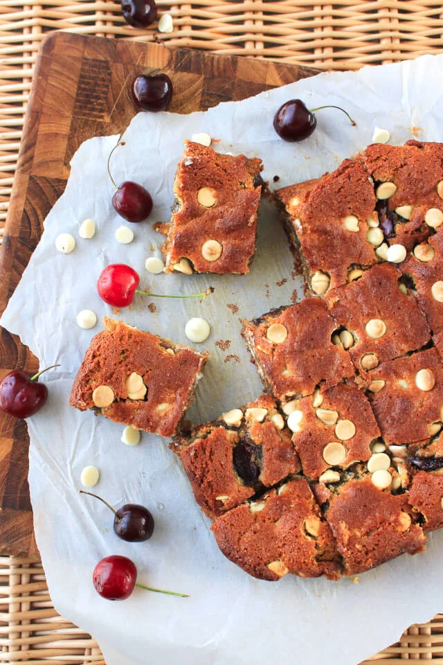 These White Chocolate Cherry Almond Butter Blondies are a better-for-you brownie made with coconut oil, almond flour, honey, and fresh cherries. #feastndevour