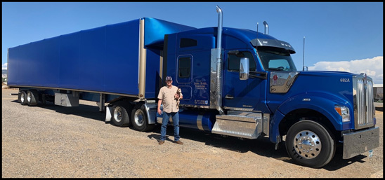 Larry Martin stands with his 2019 Kenworth W990