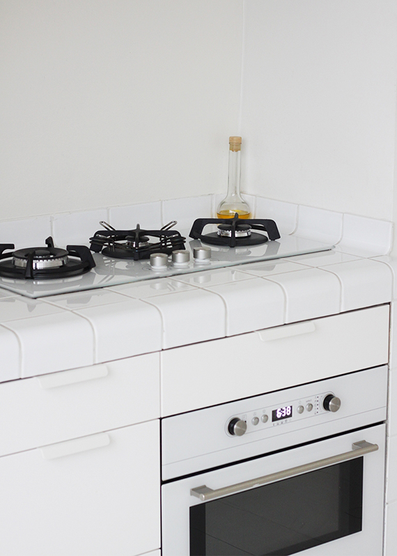 Kitchen with white tiles countertop in Hotel Droog in Amsterdam via Marie-Stella-Maris