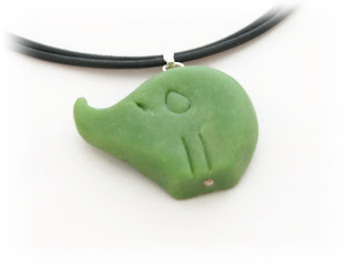 Faux jade elephant pendant created from polymer clay now available in my Etsy Store