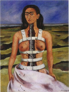 Self portrait showing Kahlo standing in a pink billowing skirt and no top. Her front is cracked open from under her chin to her pelvis, showing a cracked metal spine inside. Over her shoulders and around her torso are thick, white bands that look like some sort of stiff brace or other painful medical device. All over her skin nails are sticking out of her, and some of the nails are bigger than others, particularly those in her left breast. Below her eyes, her cheeks are covered with tears. The background shows a dark swirling blue sky, and the landscape is many shades of green and brown and looks desolate.