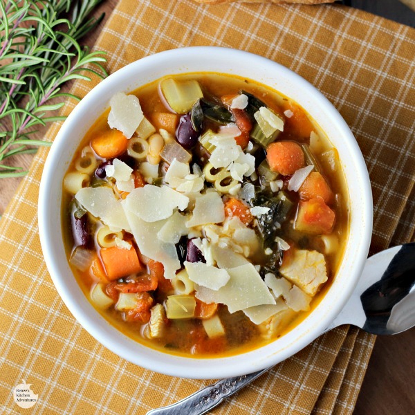 Turkey Minestrone Soup by Renee's Kitchen Adventures in a white bowl, overhead shot