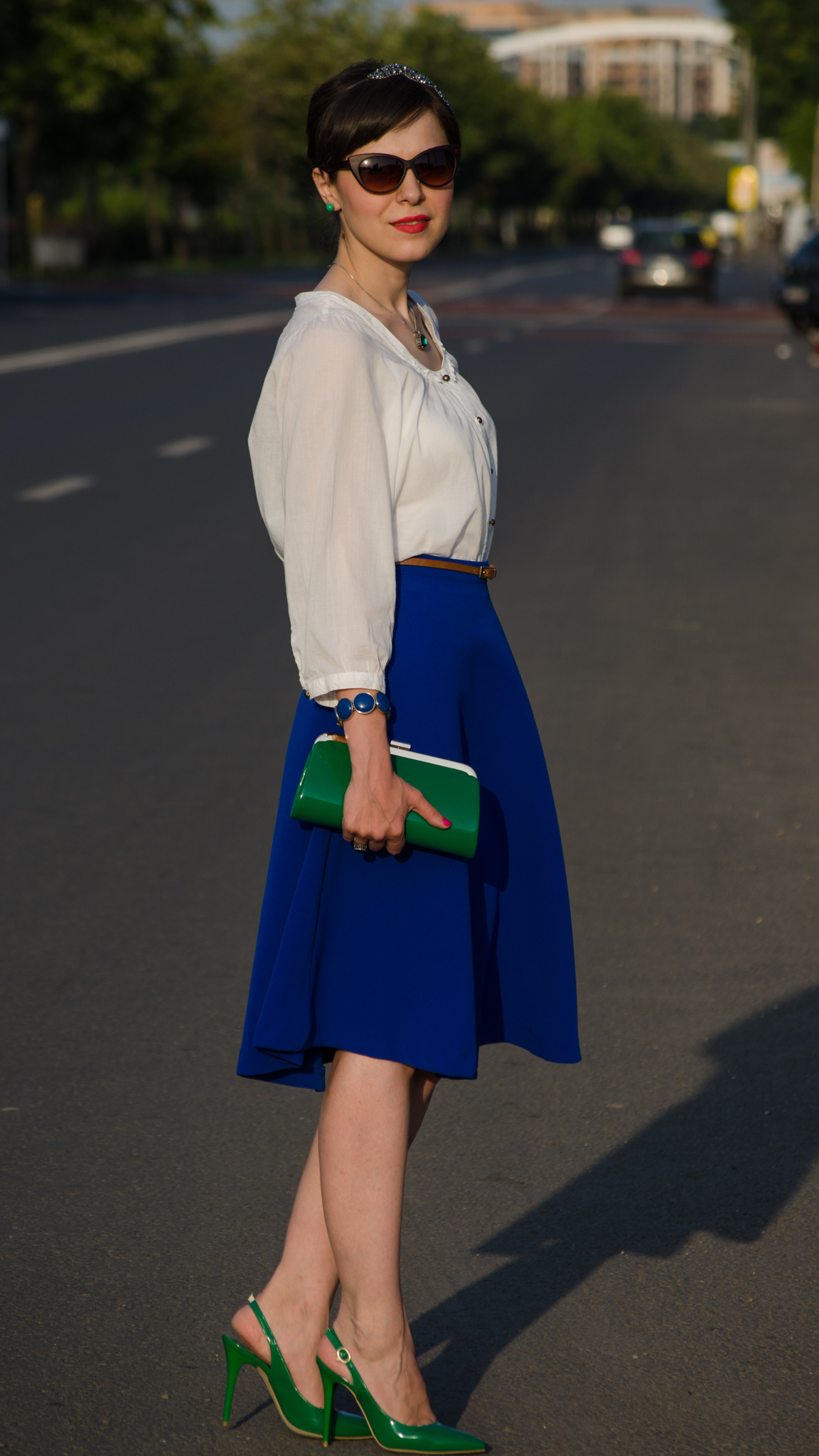 cobalt skirt white shirt emerald green heels emerald green clutch