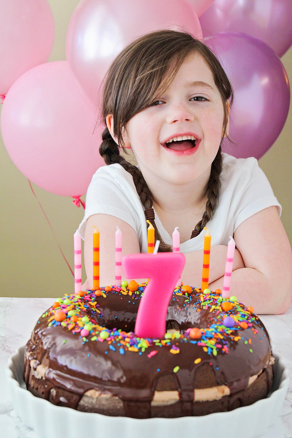 This fun and whimsical chocolate donut birthday cake is so delicious and indulgent!