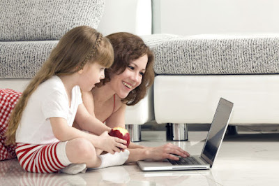 Girl and mommy with laptop