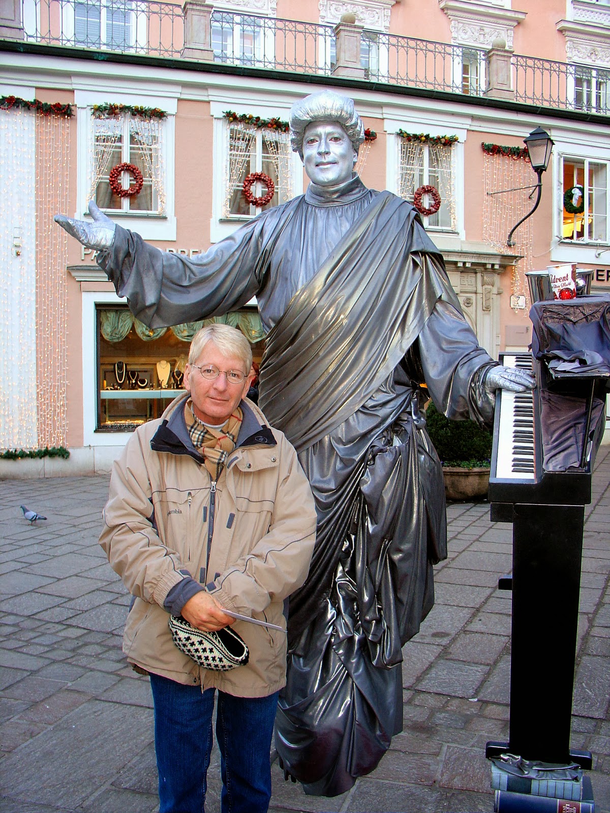 Having fun with the living statues in Salzburg. Here's Matthew with a floating Mozart?