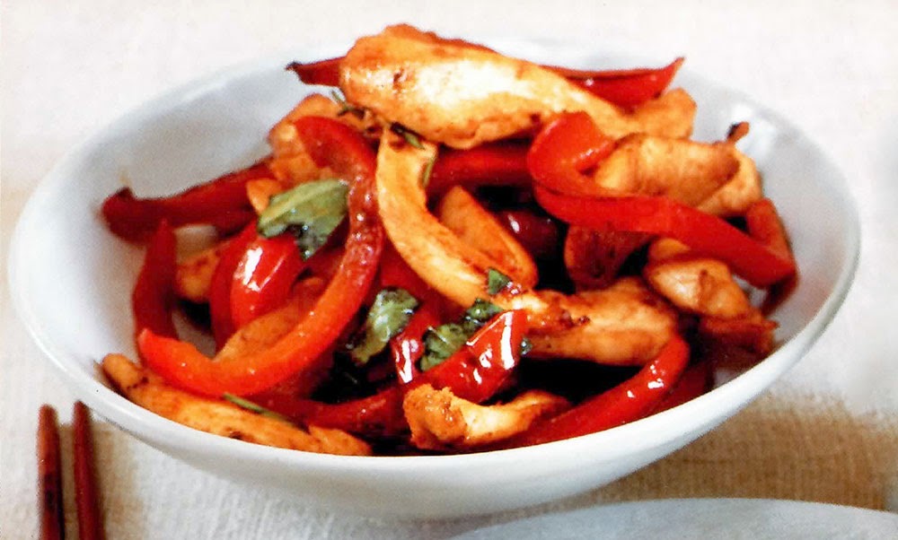 Stir-fried Chicken with Thai Basil: A classic Thai-inspired stir-fry dish of chicken and red bell pepper in a chilli, fish sauce and lime juice base finished with Thai basil. Very quick to make, this is a great week-night family dish.