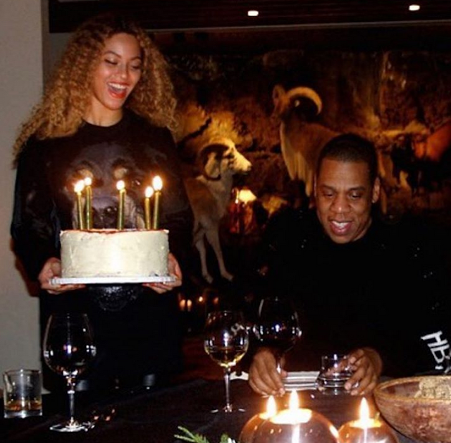 Jay Z gets cake from his wife Beyonce as they celebrate his 48th birthday...