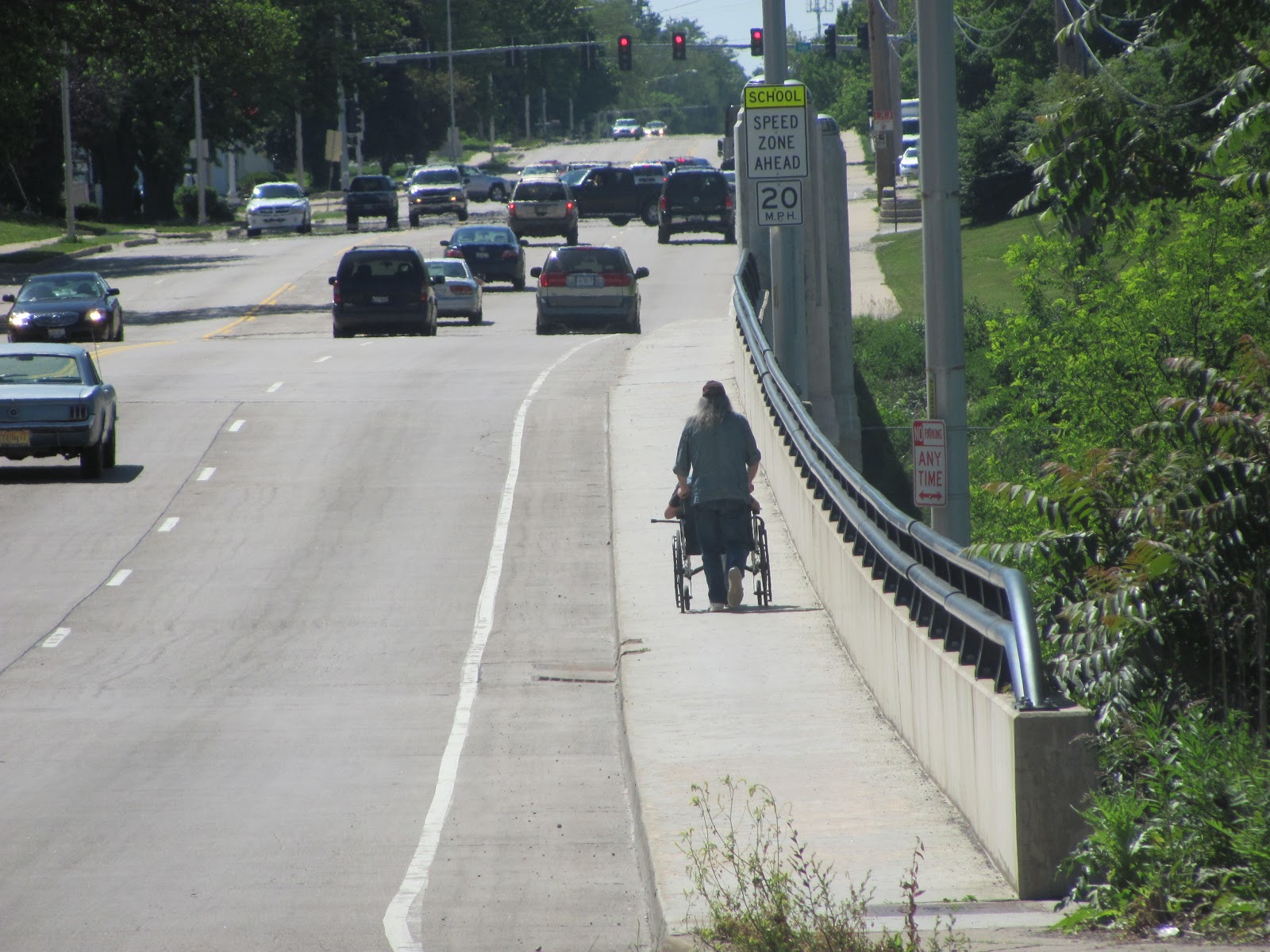 Lensing and Shuttering Wheelchair Crossing a Bridge