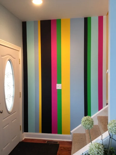 colorful painted stripe entry wall