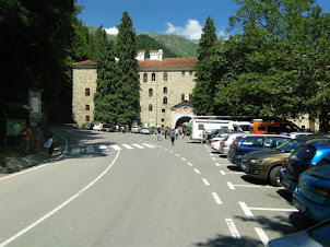 Parking lot and main entrance gate to Rila Monastery