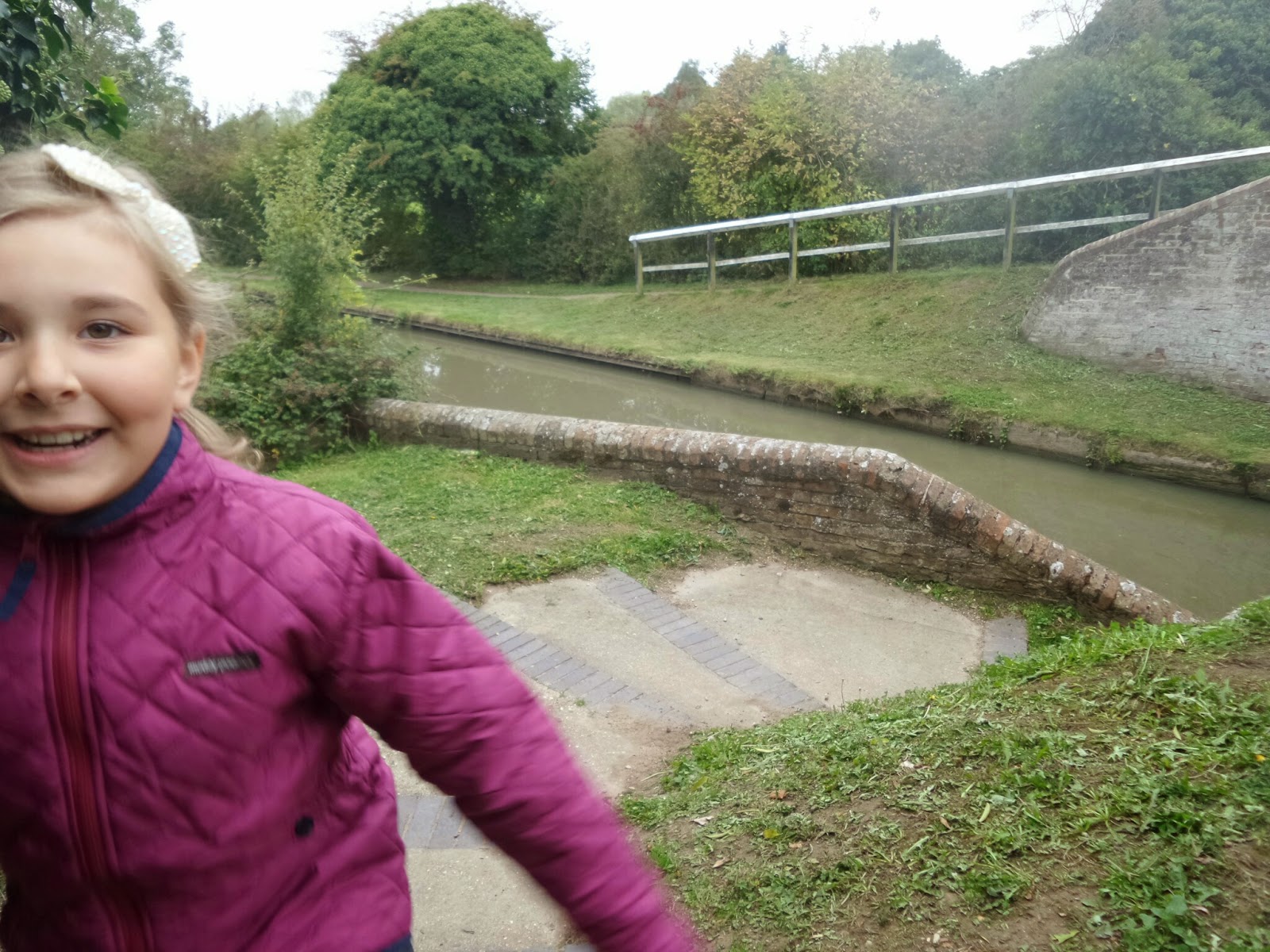 Top Ender bounding up the Canal Towpath in her Muddy Puddles jacket