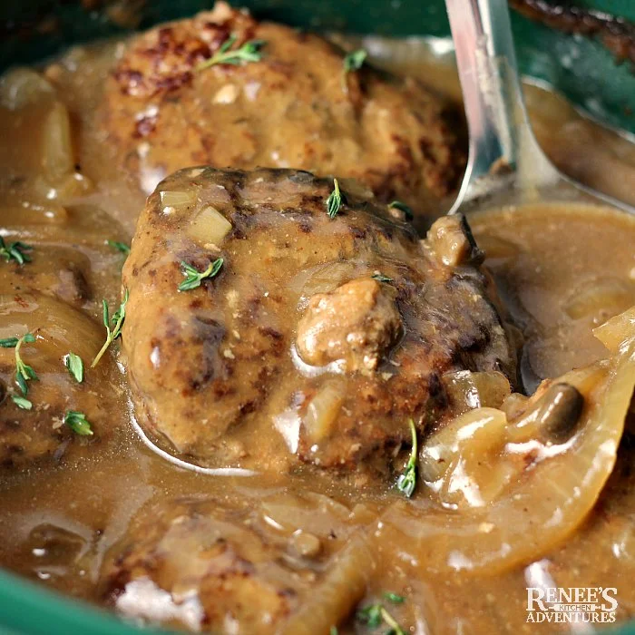 Slow Cooker Salisbury Steak patties in gravy in slow cooker ready to serve