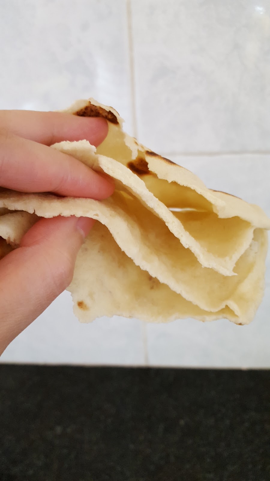 Layered Pita bread on pan (using sourdough starter)