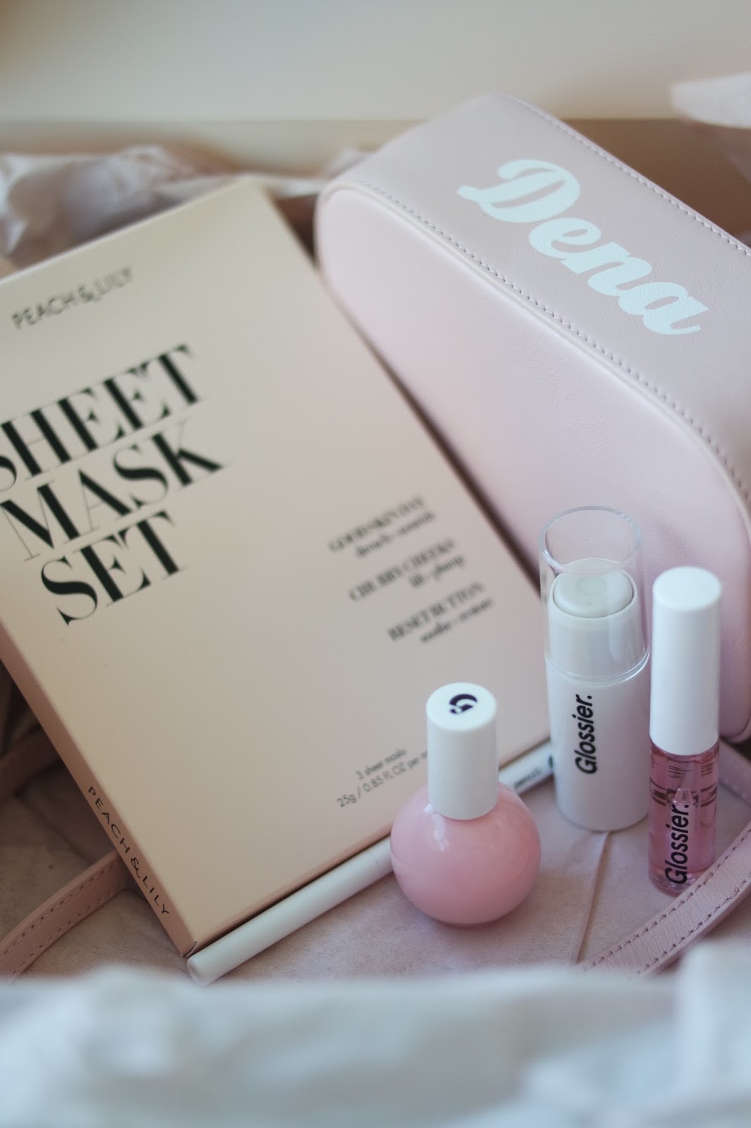 In the Pink Glossier's Black Tie Set and Peach & Lily's New Face Mask