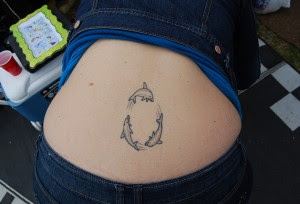 Dolphin Tattoos For Lower Back,lower back tattoo designs,lower back tattoo,dolphin tattoo designs,dolphin tattoos,tattoos on the lower back,dolphin tattoo,lower back tattoo ideas,tattoo for lower back