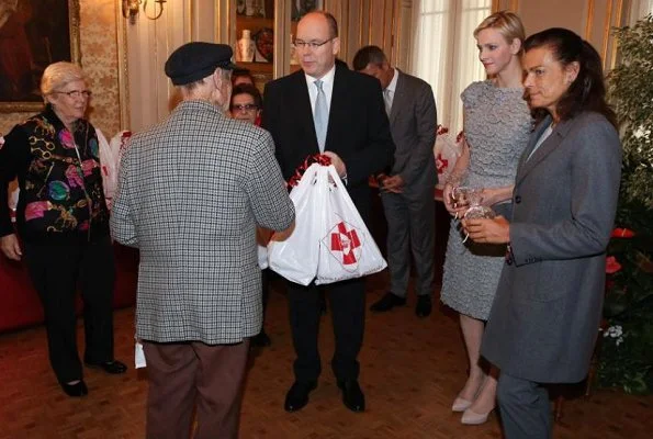 Prince Albert and Princess Charlene then handed out beautiful gifts to the 97 little ones