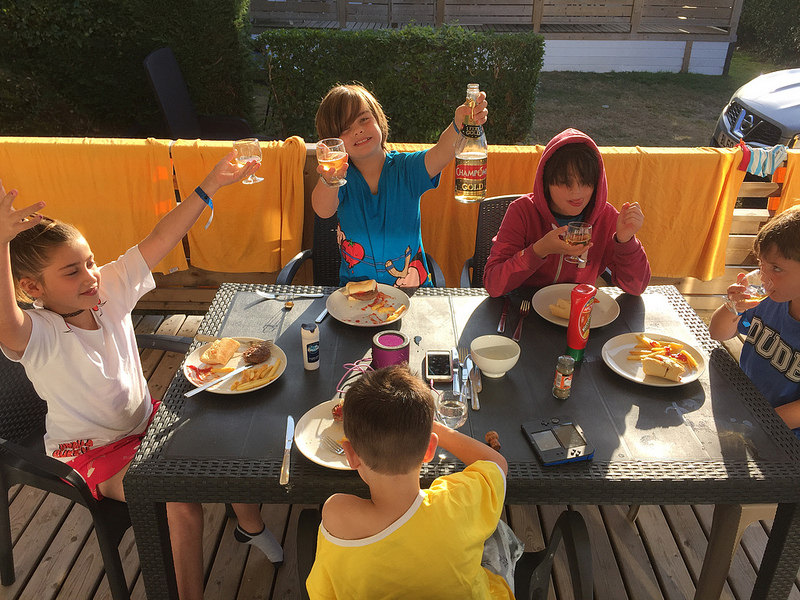 Kids eating dinner on the deck