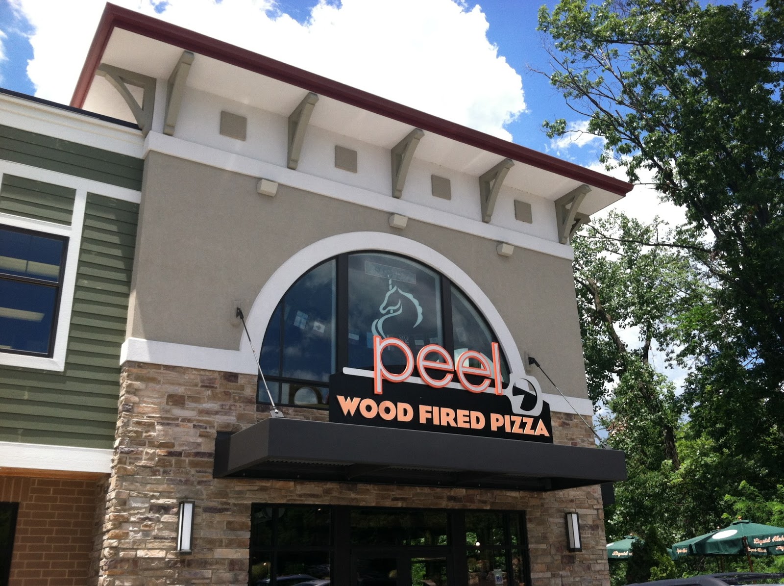 Right here in St.Louis PEEL WOOD FIRED PIZZA