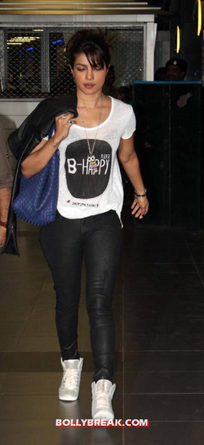  Priyanka Chopra at mumbai airport in tight leather slacks -  Priyanka Chopra latest Airport pics - black slacks and white top