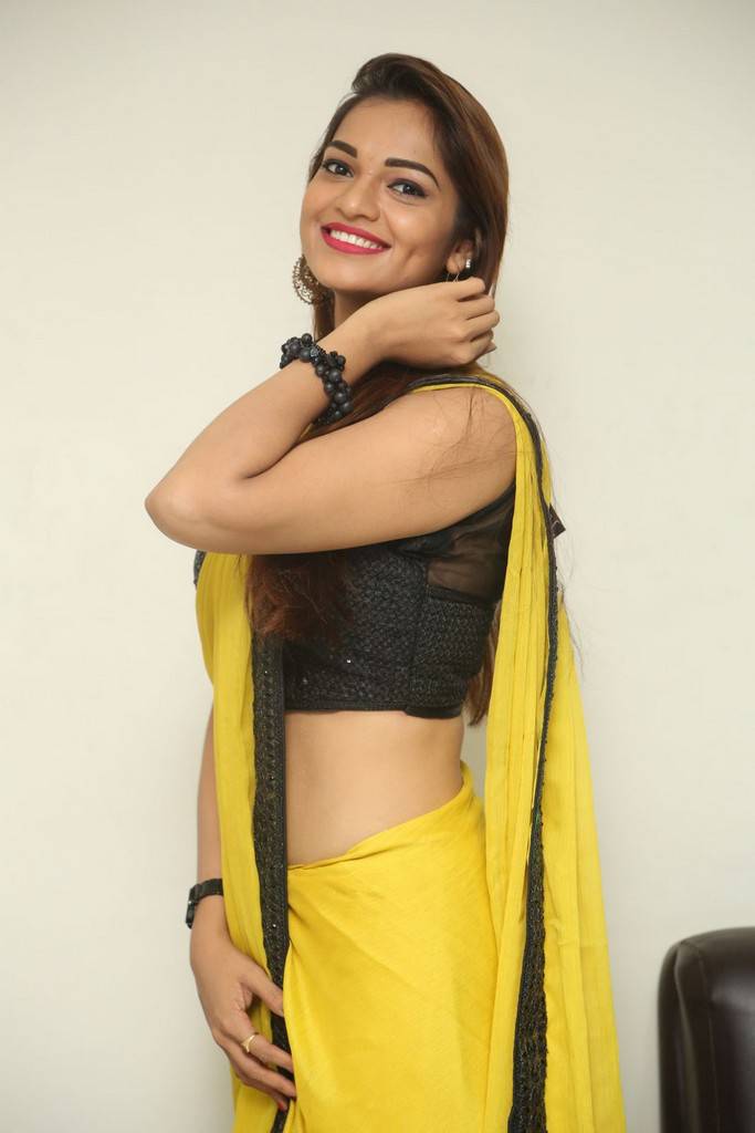 Telugu Girl Aswini Navel Hip Gallery In Transparent Yellow Saree