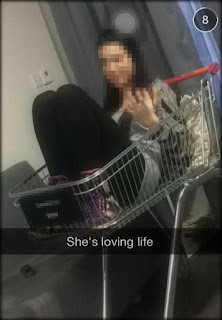 Student in a shopping trolley