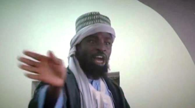 A screengrab from a video released by the Nigerian Islamist group Boko Haram shows its leader, Abubakar Shekau, preaching to locals in an unidentified town. By (Boko Haram/AFP/File)  Kano (Nigeria) (AFP) - Boko Haram's elusive leader Abubakar Shekau broke his silence Thursday to insist he was "still around" following reports Islamic State had replaced him, but his message fuelled talk of a split within the jihadist group.