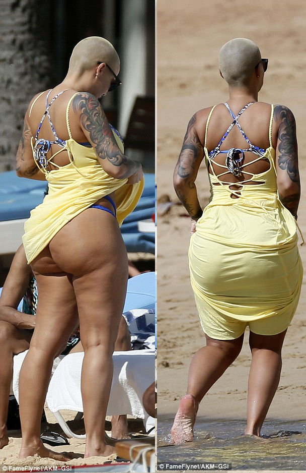 Amber Rose shows off dangerous curves as she rocks thong bikini in Hawaii.